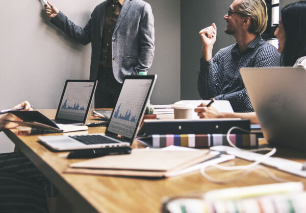 A group of people in a digital marketing meeting.